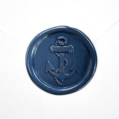 a blue wax seal with an anchor on it