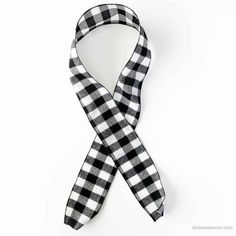 a black and white checkered tie on a white background