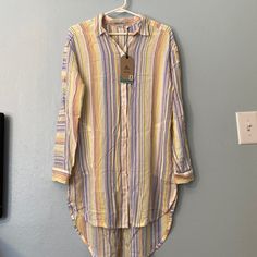 Nwt Prana Button-Up Tunic Top. Multi-Stripe, Size Medium. Colors: Periwinkle Blue, Orange, Yellow, White, And Grey. This Adorable Top Is Very Versatile! Wear With Your Favorite Leggings, Or Wear To The Beach Over Your Swimsuit. This Cute Top Will Keep You Cool And Comfortable Thanks To The Soft, Flowy Tencel Fabric. Features: Tencel Fabric, Can Be Worn As An Everyday Top Or As A Swimsuit Cover-Up, Fold-Over Collar, Full-Button Front Is Open Up Top, Single-Button Cuffs, Roll-Up Sleeves, On-Seam H Yellow V-neck Tunic For Beach, Spring Yarn-dyed Button-up Tops, Multicolor V-neck Tunic For The Beach, Spring Button-up Blouse With Vertical Stripes, Summer V-neck Tunic With Vibrant Print, Spring Vertical Stripes Button-up Blouse, Casual Multicolor V-neck Tunic, Brown Tunic, Beach-ready V-neck Rayon Tunic