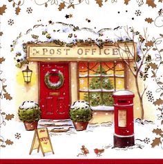 a red post box sitting in front of a store with wreaths on the door