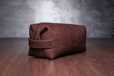 "This brown leather cosmetic bag can be comfortable and stylish accessory for your travel. Comfortable size allows you to accommodate all important travel essentials hygiene products, washing tools, combs, cosmetics, it is 30x11x10 cm or 11,8\"x4,3\"x 3,9\" size. It has 13x10 cm or 5,1\"x3,9\" size inner pocket for smaller kits; It has lining inside, 100% handmade. Side handles are made for your convenience. Note!  There can be a slight color variations, that may occur due to your monitor settin Beautiful Backpacks, Leather Cosmetic Bag, Makeup Brush Holder, Makeup Brush Holders, Leather Wear, Be Natural, Makeup Organizer, Brush Holder, Make Up Bag