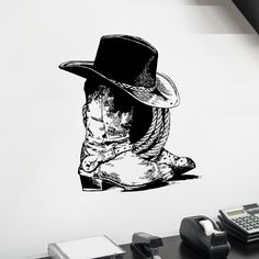 a black and white drawing of a cowboy's hat