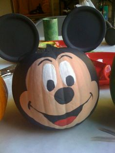 a mickey mouse pumpkin sitting on top of a table