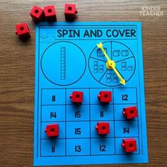 a spin and cover game with red cubes on it next to the word spin and cover