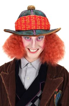 a person with red hair wearing a hat