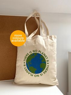 There Is No Planet B Cotton Tote Bag🌍 This reusable 100% cotton tote bag is the perfect replacement for single use plastic carrier bags! This versatile tote can be used for many things shopping, beach bag and so much more.  This cute, bright tote adds a pop of colour to any outfit while also raising awareness around climate change, global warming, etc!🌍 Information: - 100% cotton - size 38 x 42 cm  - handle length 67 cm  - capacity 10 litres  - the design covers one side of tote ( back of tote There Is No Planet B, No Planet B, Canvas Purse, Great Gifts For Women, Encouragement Gifts, Bags Aesthetic, Christmas Gifts For Friends, Carrier Bag, Reusable Grocery Bags