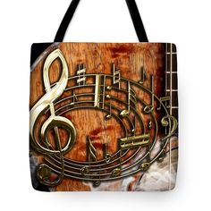 a musical instrument with music notes on it tote bag by jorgon art