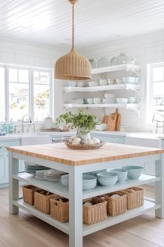 a kitchen island with baskets under it