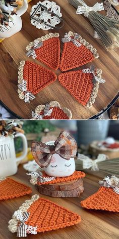 there are many crocheted items on the table and one has a bow in it