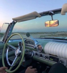 the interior of an old car with dashboard, steering wheel and sunroofer