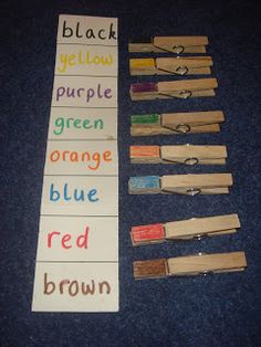 some crayons are laying out on the floor next to each other with words written in them