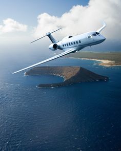 an airplane is flying over the ocean