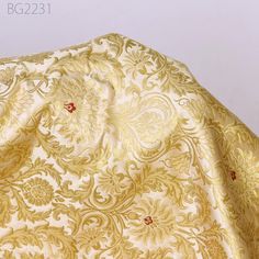 Beige Silk Brocade Fabric By The Yard Banarasi Wedding Dresses Lehenga Material Sewing Table Runner Crafting Home Decor Curtains Upholstery. This is a beautiful multi color banarasi blended silk brocade in floral design fabric in multi color (Beige with Red ) and Gold.    ➤Product: Brocade Fabric  ➤Fabric Type: Blended Silk (Viscose + Rayon and 30% Silk) Fine Quality Zari Brocade Weaving from Banaras ➤Color: Beige with Red and Gold. ➤Width: 35 inches. ➤Condition: New  ➤Code: bg2231  ➤Listing for 1 Yard of fabric. ➤Care: Dry Clean Only Super Fine Quality Brocade Weaving from Banaras. During the Mughal period (1556-1707), when brocade was extremely popular with the rich, the great center of brocade weaving were Benares (Vārānasi). You can use this fabric to make Dresses, Tops, Blouses, Jacke Elegant Wedding Fabric With Motifs, Gold Brocade Sets For Traditional Ceremonies, Cream Brocade Fabric For Wedding, Cream Brocade Wedding Fabric, Traditional Wedding Fabric With Intricate Embroidery, Gold Wedding Fabric With Motifs, Gold Brocade Embroidered Fabric For Wedding, Gold Embroidered Brocade Fabric For Wedding, Gold Wedding Embroidered Brocade Fabric