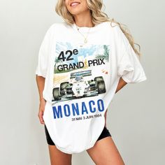 Introducing our Vintage-Inspired Monaco Grand Prix Tee Shirt. Crafted on a Comfort Colors Unisex Tee, this shirt offers the perfect blend of vintage charm, modern comfort, and style. 👕 Comfort Colors Unisex Tee: Made from premium 100% ring-spun cotton, the Comfort Colors Unisex Tee guarantees exceptional softness and comfort. Its relaxed fit and robust construction ensures comfort and durability. Whether you're cheering at the racetrack or lounging with friends, this tee delivers unbeatable comfort. 🕰️ Timeless Style:  Perfect for casual outings, race day gatherings, or expressing your love for F1 🌟 Key Features: Vintage-inspired Monaco Grand Prix graphic. High-quality, soft 100% ring-spun cotton. Comfort Colors Unisex Tee for ultimate comfort. Classic fit suitable for all genders. Uniq F1 Monaco, Monaco Grand Prix, Vintage Tshirts, Grand Prix, Monaco, Comfort Colors, Unisex T Shirt, Timeless Fashion, Vintage Style