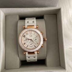 Brand New Guess Collection Watch With Box. Retail Price $450 Be Cool And Confident In Smooth Ceramic In Crisp White With Matching Guilloche Dial Picked Out With Rose-Gold Accents With Multi-Function Day-Date And Second Time Zone Sub Dials And Arabic Numerals, On An Intricate Multi-Link Ceramic Bracelet With Butterfly Clasp. 316l Stainless Steel Water Resistant To 100 Meters Water Resistant To 100 Meters Sapphire Coated Mineral Crystal Sapphire Coated Mineral Crystal Swiss Made Movement Swiss Mad Ceramic Bracelet, Guess Watch, Rose Gold Accents, Gold Ceramic, Rose Gold Case, Time Zone, Be Cool, Women's Watch, Stainless Steel Band