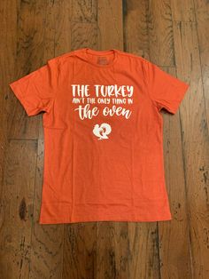 Sizing is men's standard t shirt sizes. Lettering is heat transfer vinyl. Customization available. Thanksgiving Maternity Shirt, Thanksgiving Pregnancy Shirt, Womens Graphic Tees, Maternity Shirt, Pregnancy Shirts, Transfer Vinyl, Graphic Tees Women, Heat Transfer Vinyl, Heat Transfer