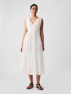 Soft pleated maxi dress.  V-neck, V-back.  Sleeveless.  Tie belt at waist.  Tiered skirt.  * Fit: Slim.  A fit & flare silhouette that sits close to the body & flares at the waist.  Hits at the ankle.  Models wearing Gap Sleeveless Maxi Dress With Tie Waist For Daywear, Fitted Gap Maxi Dress, Gap Midi Length Maxi Dress For Spring, Chic Fitted Gap Maxi Dress, Gap Spring Midi Length Maxi Dress, Summer Chic Maxi Dress By Gap, Chic Summer Maxi Dress By Gap, Gap Spring Midi Maxi Dress, Summer Chic Gap Maxi Dress