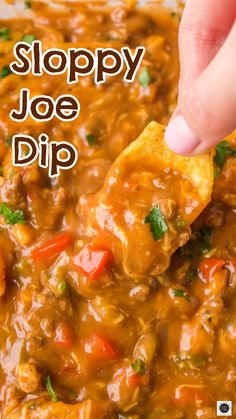 a hand dipping tortilla chips into a bowl of soup with the words sloppy joe dip above it