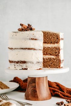 a cake with white frosting and cinnamon sprinkles