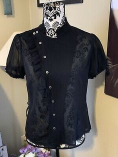 All Saints Black Sheer Button Front 100% Silk Blouse Sz 6 | eBay Spring Season Gothic Formal Tops, Gothic Fitted Tops For Workwear, Vintage Black Office Tops, Vintage Black Office Top, Black Gothic Short Sleeve Blouse, Fitted Short Sleeve Gothic Blouse, All Saints, Silk Blouse, Fashion Inspo