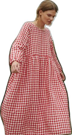 a woman in a red and white checkered dress