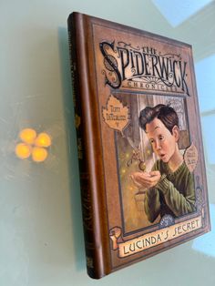 the spiderwick book is hanging on the wall