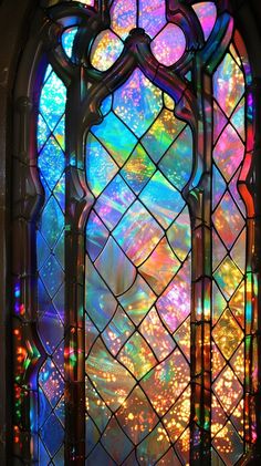 an ornate stained glass window with colorful lights