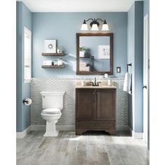 a bathroom with blue walls and white tile on the floor is shown in this image