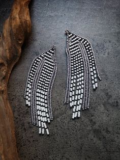 two pairs of silver and white beaded earrings