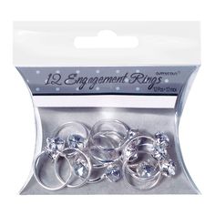 an assortment of rings in a package with clear crystal stones on the top and bottom