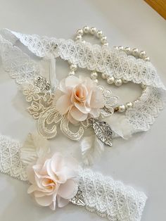 Beautiful, Vintage Inspired Garter Set  © 2022 Tidesigns  ~~ Important ~~ Please make sure to leave your thigh measurement in "Note to seller" during checkout. If not, I will make the garter set to 17" & it will stretch up to 20" .Please mention your wedding date to ensure timely delivery. This gorgeous garter set is made with beautiful ivory lace (stretchable). It is decorated with blush pink flowers, Gorgeous A grade Rhinestone applique embellishment and beautiful pearls and rhinestones.   ** Rhinestone Applique Embellishments, Pink Garter, Rhinestone Garter, Fashion Tape, Wedding Garter Set, Rhinestone Appliques, Garter Set, Wedding Garter, Ivory Lace