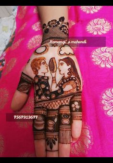 a woman's hand painted with hennap and mehndi