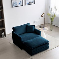 a blue chair sitting on top of a white rug