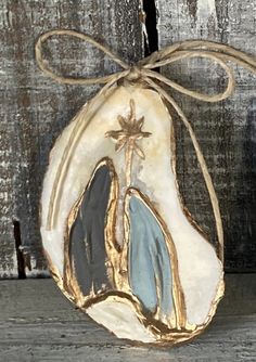 a ceramic ornament with a cross on it