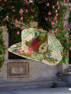 Step into a world of regal elegance with "Napoleon," a hat that evokes the grandeur and majesty of an imperial garden. Featuring the stunning verdant garden scape linen fabric draped over a sturdy canvas cowboy hat, this piece pays homage to the opulence of a bygone era. Picture yourself in the sprawling gardens of Château de Malmaison, where Napoleon and Josephine once strolled among the lush landscapes. The fabric mirrors the vibrant greens of manicured lawns and the delicate blooms of a summer garden, each detail a testament to nature's splendor. Don "Napoleon" and feel the embrace of imperial luxury. The luxurious linen fabric, adorned with intricate garden scenes, drapes over the structured canvas hat with an effortless grace. Proudly American Made. Exclusive fabric hats created and h Green Western Style Hats For Spring, Green Western Hats For Spring, Green Summer Hat For Rodeo, Green Hats For Country Events In Spring, Green Hats For Spring Country Events, Green Spring Hats For Country Events, Green Hat For Kentucky Derby And Country Events, Vintage Sun Hat For Country Events In Spring, Vintage Sun Hat For Spring Country Events