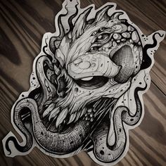 a sticker with an image of a dragon's head in black and white