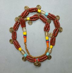 This necklace, strand glass beads and metal pendants originates from the Naga. The hanging length of the strand is 34 cm. The diameter of the beads is 0.4  cm to 0.9 cm. The pendants are 1,5 cm long.  Its weight is 89 gram. (s05) SHIPPING SHIPMENT is FREE. All items are shipped every week on monday morning after receipt of payment. We send priority airmails. Please consider overseas shipments take usually 5 - 8 days. Insured packets (over 50 cm length / over 1500 gram) I send by standard way. PA Festival Amulet Jewelry With Wooden Beads, Festival Amulet Style Jewelry With Wooden Beads, Amulet Style Jewelry With Wooden Beads For Festival, Wooden Beads Amulet Jewelry For Festival, Traditional Wooden Beads Jewelry For Beach, Festival Polished Pendant Beads, Beach Festival Jewelry With Large Beads, Bohemian Beaded Necklace With Oval Beads For Festival, Bohemian Oval Beads Necklace For Festival