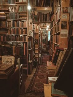 an old library filled with lots of books on shelves next to a doorway that leads to another room