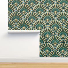 an art deco wallpaper with gold and teal fan design on the wall next to a wooden floor