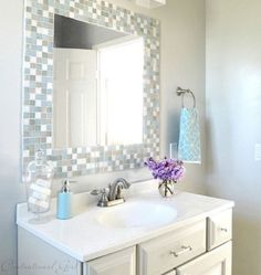 a bathroom sink with a mirror above it