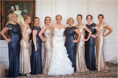 a group of women standing next to each other in formal wear and posing for the camera