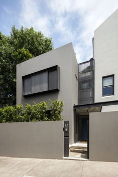 an apartment building with stairs leading up to it