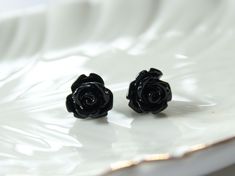 Get your Halloween game on this season with just a hint of spooky! These little black rose studs are a nice, neutral add to your October look. Trust me, they're just booooo-tiful.Details:~ This listing is for ONE pair of black rose stud earrings~ Materials: high quality resin and surgical steel ear posts and butterfly clutches~ Flower Diameter: 10mm (less than 1/2 inch)~ Each pair of earrings (or set) comes attached to a branded card and is wrapped in a lovely, branded gift box tied with ribbon Black Rose Ring, Rose Stud Earrings, Black Stud Earrings, Earrings Bridesmaid, Etsy Bridesmaid Gifts, Flower Stud Earrings, Earrings Flower, Rose Ring, Flower Stud