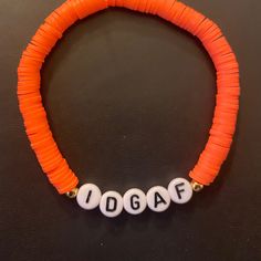 This listing is for a 1 bracelet with 14k gold spacer beads included. Made with 6mm clay beads and high quality jewelry elastic. When wearing be sure to roll bracelet on instead of stretching to prevent breakage. (Bracelet color shown in picture: Orange) Personalization: You have the option to select bracelet color. In the Personalization box you can request a bracelet size that is not listed, 14k gold spacer or stainless steel spacer, and color of letter beads (white with black letters or black Funny Beaded Bracelets Words, Funny Bracelets Beads Words, Funny Bracelets, Image Orange, Rave Bracelets, Diy Friendship Bracelet, Clay Bead Bracelet, Bracelet Quotes, Kandi Bracelets