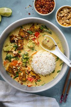 a bowl filled with rice, meat and veggies