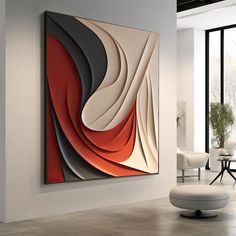 an abstract painting hanging on the wall in a room