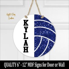 a blue and white door hanger with the name kyhlah hanging from it