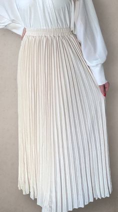 Modest high rise maxi skirt. Elastic waistband. Pleated. Fully lined for full coverage. Chic Beige Stretch Pleated Skirt, Chic Stretch Beige Pleated Skirt, Chic Stretch Long Pleated Skirt, Chic Long Stretch Pleated Skirt, White Stretch Maxi Length Bottoms, Elegant Non-stretch Maxi Skirt For Spring, Elegant Beige Stretch Maxi Skirt, Stretch Beige Pleated Maxi Skirt, Beige Maxi Length Spring Bottoms