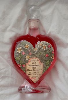 a heart shaped bottle with a message on it