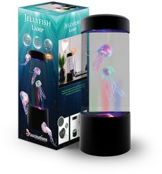 the jellyfish lamp is in its box next to it's packaging